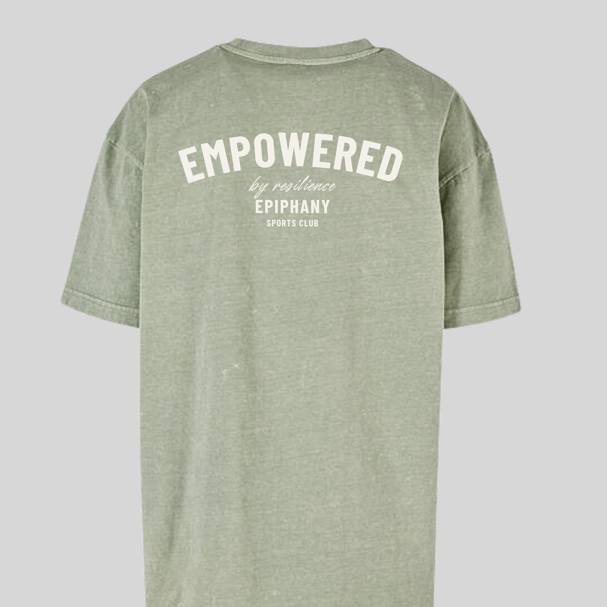 Back view of women's oversized acid wash t-shirt in green with 'Empowered by Resilience' text.